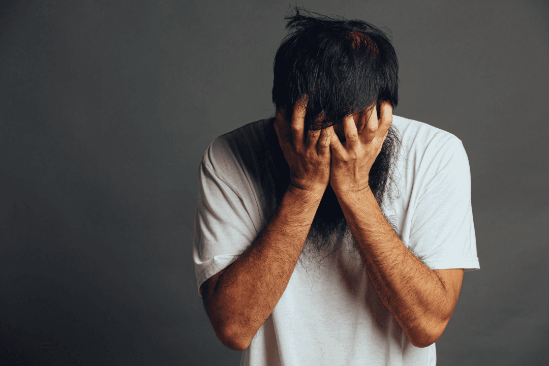 man-stress-out-cover-his-face-by-his-hands